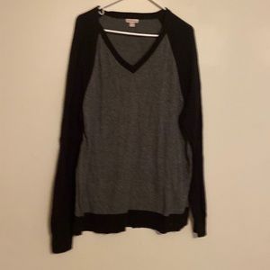 Long sleeve sweater is black and gray. The size is extra large.